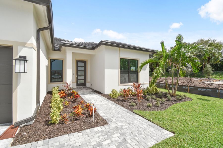 Exterior details and patio area of a home in Greyhawk Landing, Lake Worth (Image 22).
