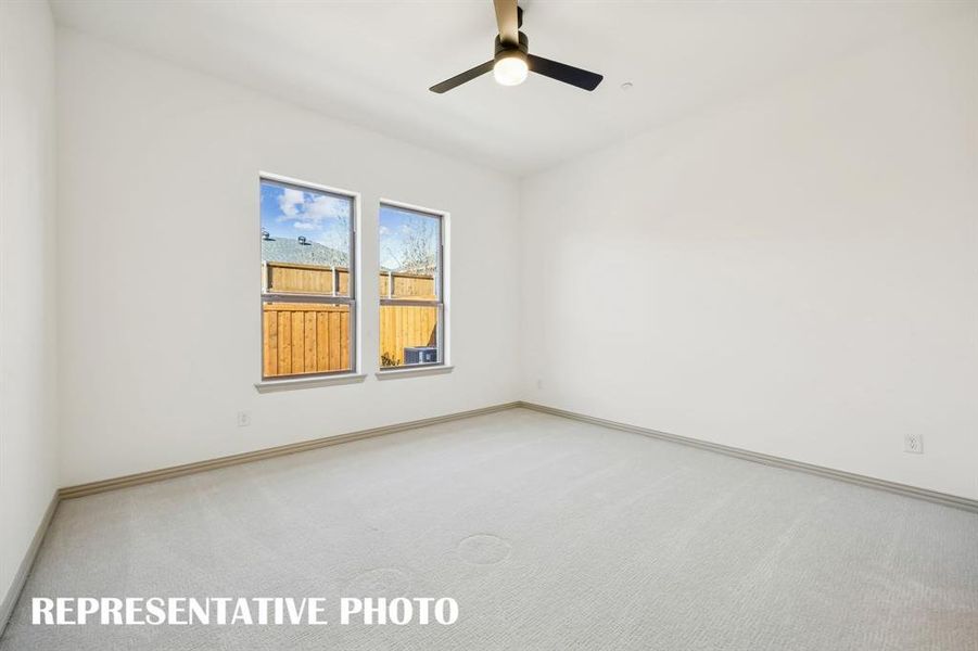 Located on the main level at the rear of the home, this owner's suite was designed for rest and relaxation.  REPRESENTATIVE PHOTO