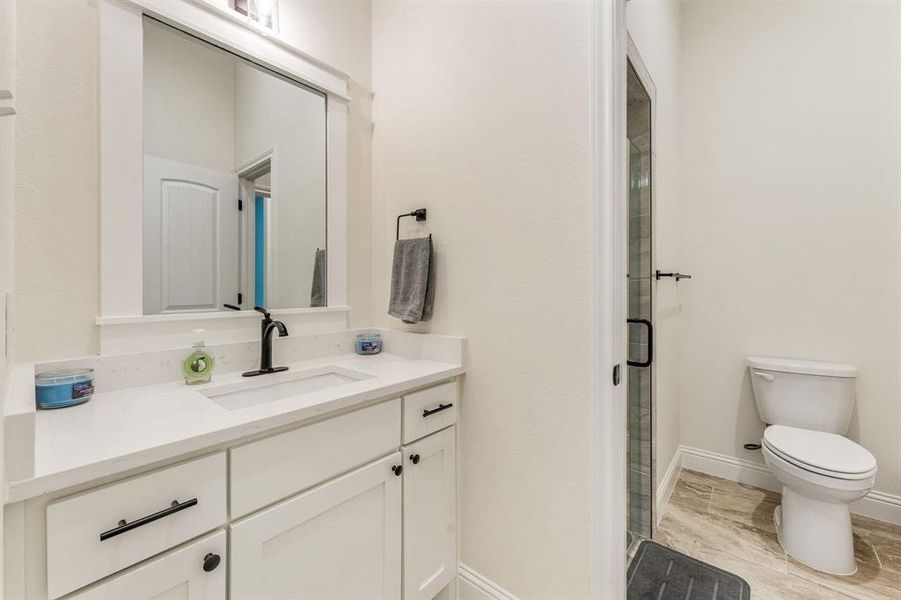 Bathroom featuring vanity and a stall shower Bathroom featuring vanity and a stall shower