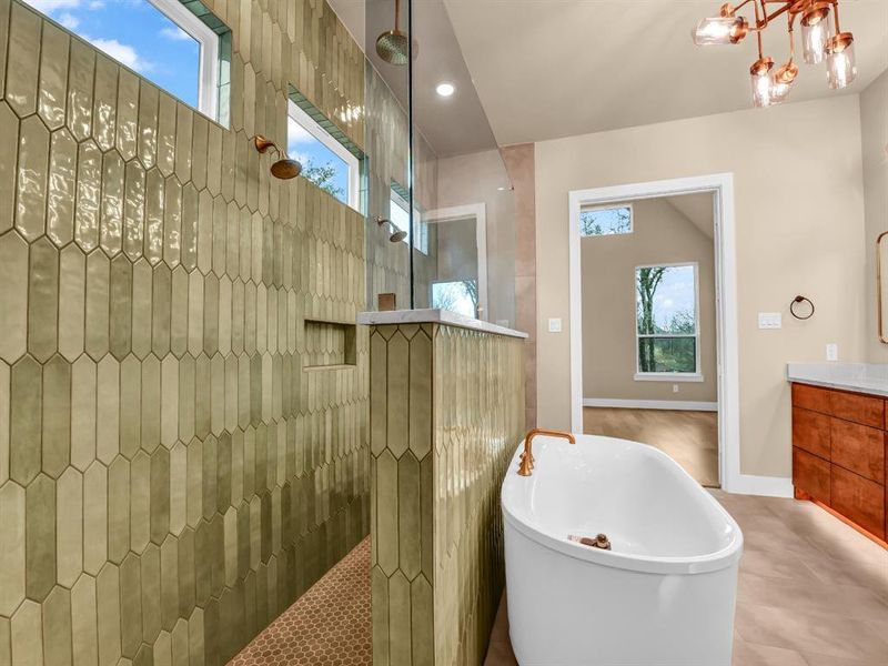 Bathroom with tile patterned floors, vanity, and separate shower and tub