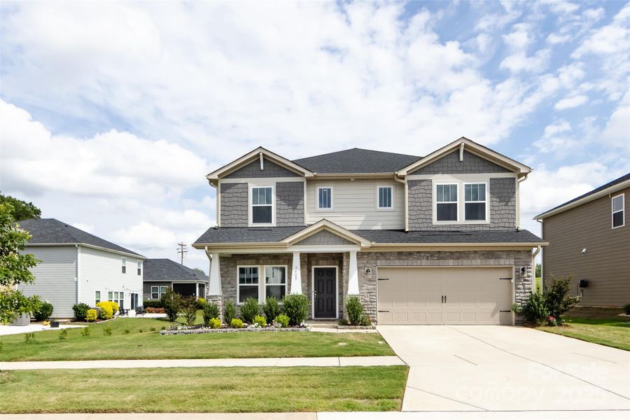 Front exterior of a new home in Simpson Farms, Monroe, NC, highlighting curb appeal (Image 22).