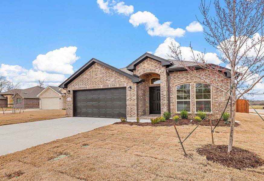Representative exterior photo of a completed home built from the Devin by Cheldan Homes in Sunset Ridge, Keene, TX (Image 30). Representative exterior photo of a completed home built from the Devin by Cheldan Homes in Sunset Ridge, Keene, TX (Image 30).