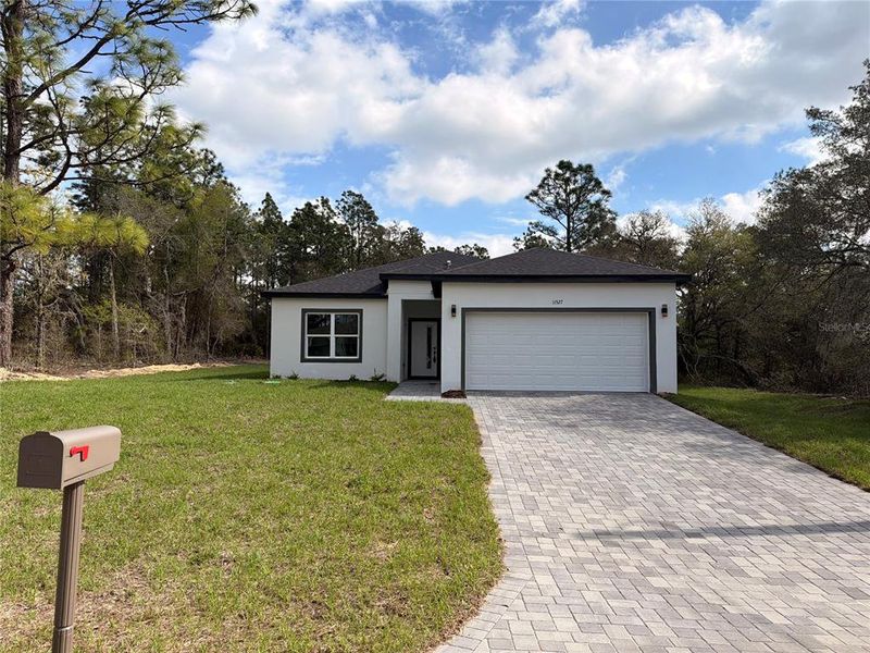 Front exterior of a new home in , Dunnellon, FL, highlighting curb appeal (Image 23). Front exterior of a new home in , Dunnellon, FL, highlighting curb appeal (Image 23).