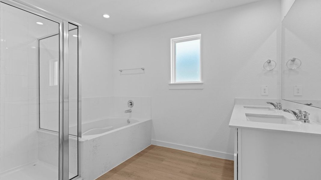 Furnished interior view inside a new home in Caldwell Crossing, Iowa Colony (Image 9).