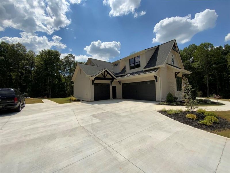 Front exterior of a new home in , Conyers, GA, highlighting curb appeal (Image 2). Front exterior of a new home in , Conyers, GA, highlighting curb appeal (Image 2).