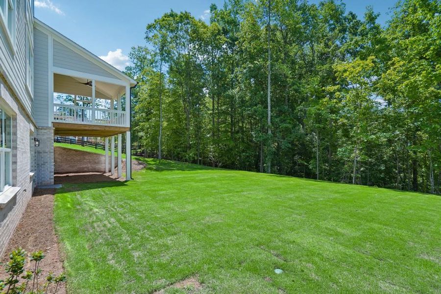 Exterior details and patio area of a home in Arden on Lanier, Cumming (Image 24).
