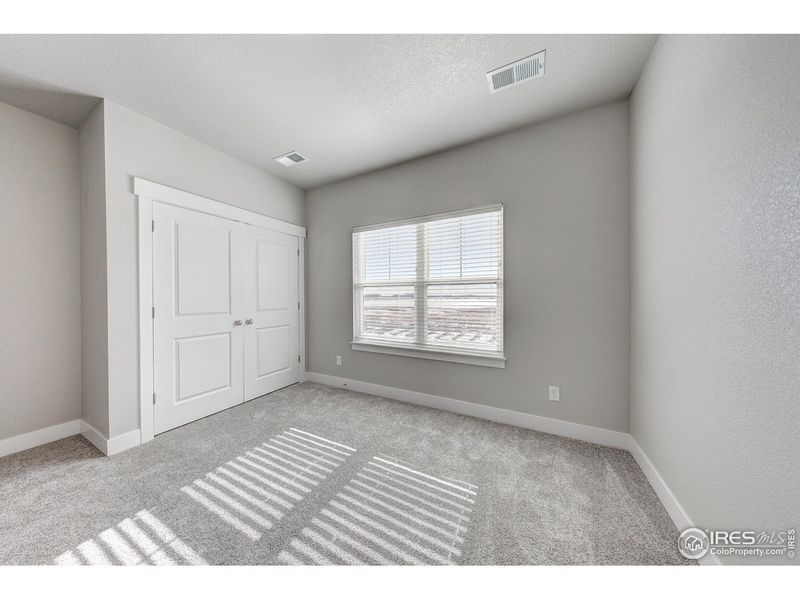 Spacious, unfurnished interior of a new home in Highlands at Fox Hill - The Flats, Longmont (Image 21).
