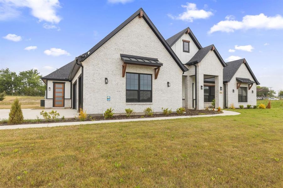 Front exterior of a new home in Capitol Hill, Anna, TX, highlighting curb appeal (Image 24).