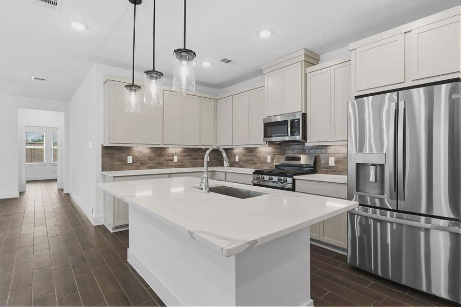Representative furnished interior of a home built from the Carriagehouse by Chesmar Homes in Meridiana Townhomes, Iowa Colony (Image 60).