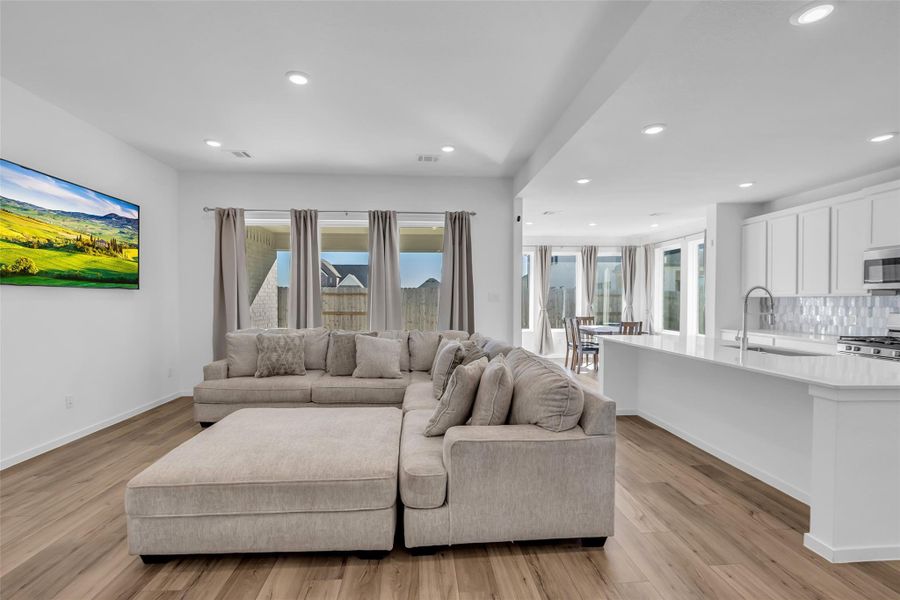 Open Living & Kitchen: A spacious, light-filled gathering space where everyday living and entertaining come together with ease. The open sightlines, generous scale, and calm palette create a setting that feels intentional, comfortable, and quietly impressive. Open Living & Kitchen: A spacious, light-filled gathering space where everyday living and entertaining come together with ease. The open sightlines, generous scale, and calm palette create a setting that feels intentional, comfortable, and quietly impressive.