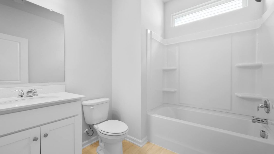 Representative furnished interior of a home built from the FORRESTER by D.R. Horton in Founders Corner, Summerville (Image 7).