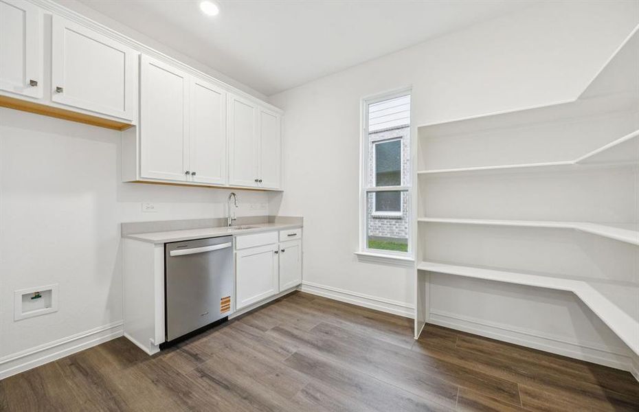 Oversized laundry room with walk in pantry