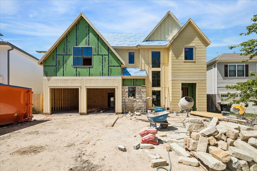 Harvard Homes presents a fresh take on modern comfort at 1510 Chantilly, crafted with natural light, designer fixtures throughout and a built-in pool. The first floor opens with a bright great room framed by a wall of windows and built-in cabinetry, flowing easily into the dining room and a generous verandah. *Current construction 4/7/26