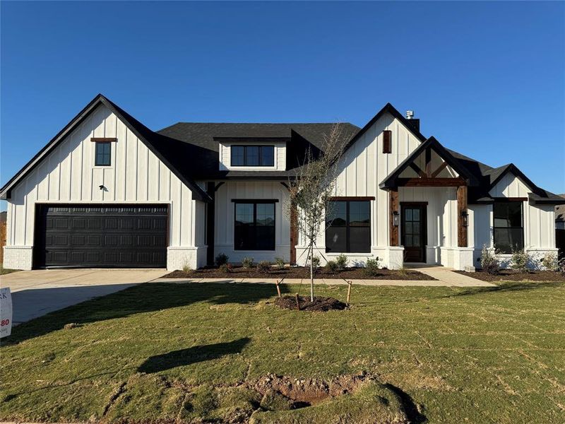 Front exterior of a new home in Coyote Crossing, Godley, TX, highlighting curb appeal (Image 1). Front exterior of a new home in Coyote Crossing, Godley, TX, highlighting curb appeal (Image 1).