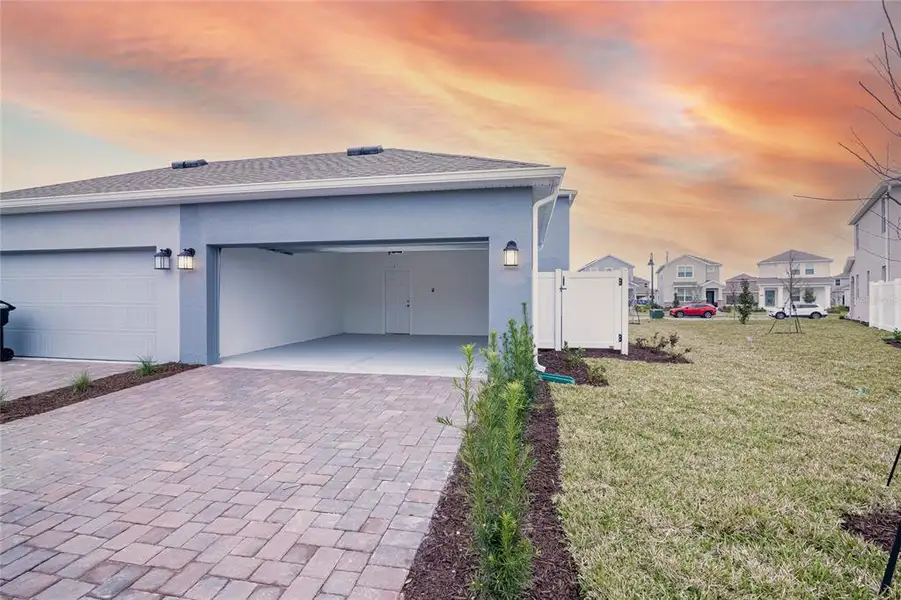 Front exterior of a new home in , Orlando, FL, highlighting curb appeal (Image 1).