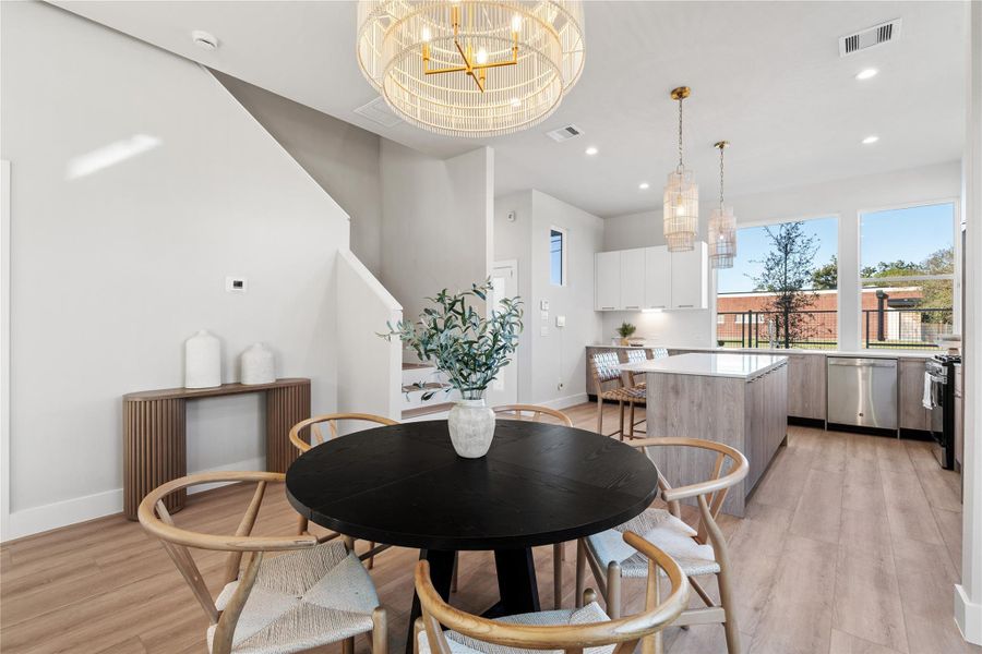 Soaring 10-ft ceilings & designer lighting create an airy, elegant atmosphere as natural light highlights the craftsmanship & clean lines of the first floor. Soaring 10-ft ceilings & designer lighting create an airy, elegant atmosphere as natural light highlights the craftsmanship & clean lines of the first floor.