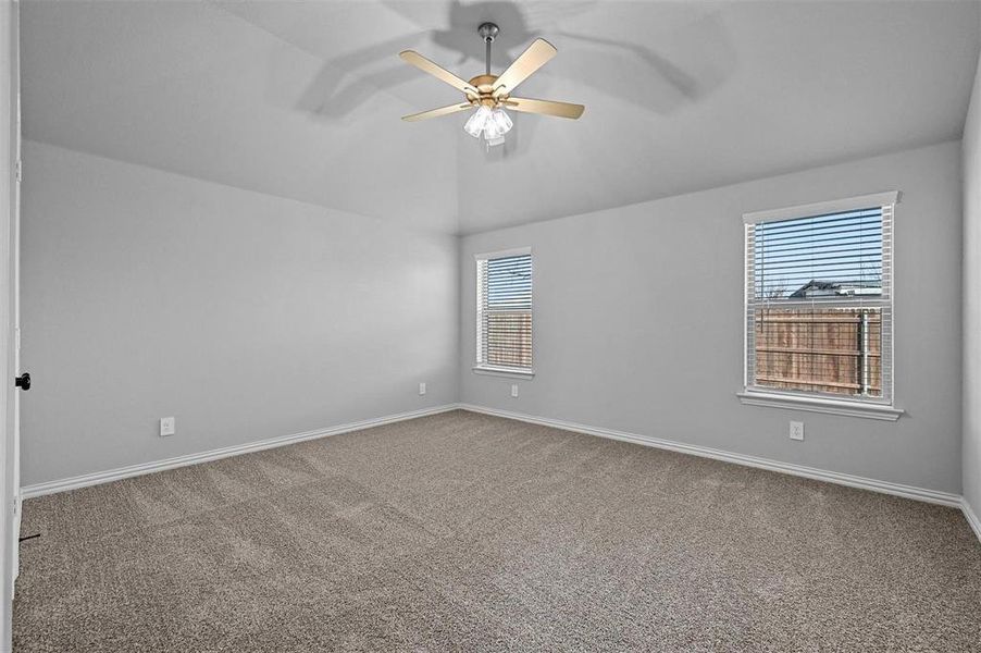 carpet, vaulted ceiling, and ceiling fan carpet, vaulted ceiling, and ceiling fan