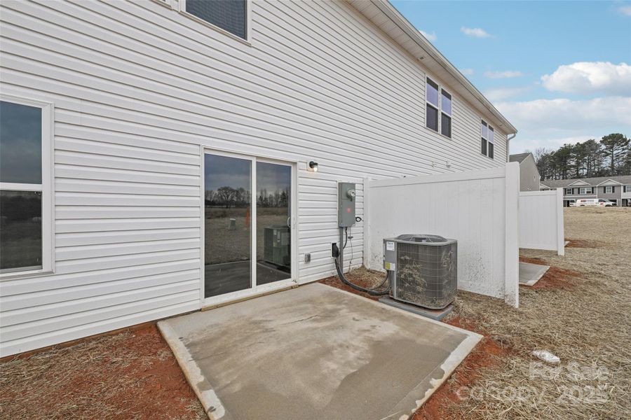 Exterior details and patio area of a home in The Towns at Green Needles, Lexington (Image 8).