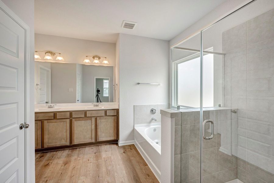 The Oriole II- Primary Bathroom with Separate Garden Tub and Shower. The Oriole II- Primary Bathroom with Separate Garden Tub and Shower.