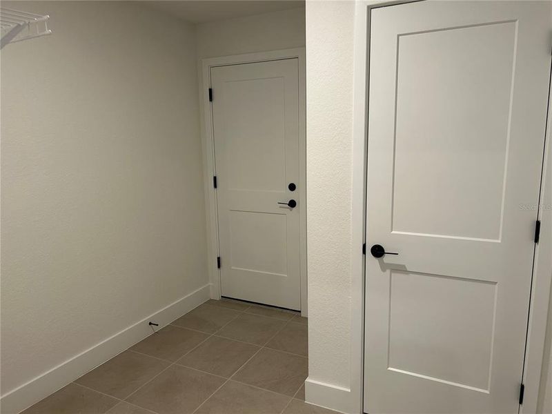 Spacious, unfurnished interior of a new home in Watercress Cove, North Port (Image 14).