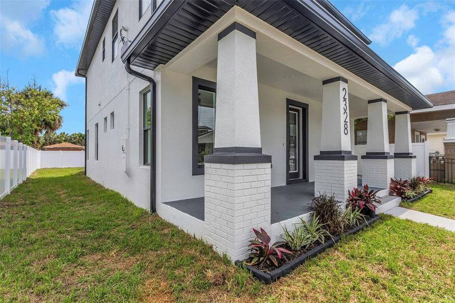 Front exterior of a new home in , Tampa, FL, highlighting curb appeal (Image 16).