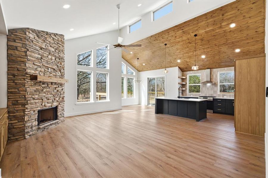 Stone fireplace, vaulted stained ceilings, and so much more!