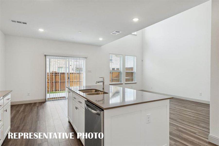 Light, bright and airy, this open concept kitchen-dining-living area is everything you have been searching for!  REPRESENTATIVE PHOTO