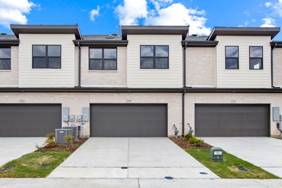Front exterior of a new home in Ten Mile Creek, Celina, TX, highlighting curb appeal (Image 26). Front exterior of a new home in Ten Mile Creek, Celina, TX, highlighting curb appeal (Image 26).