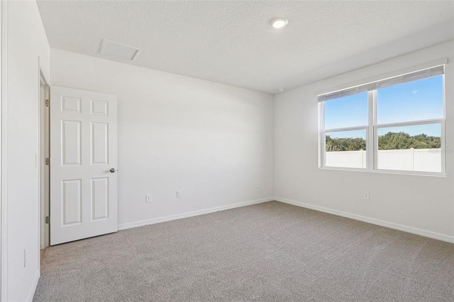 Spacious, unfurnished interior of a new home in Bradbury Creek - Signature Series, Haines City (Image 14).