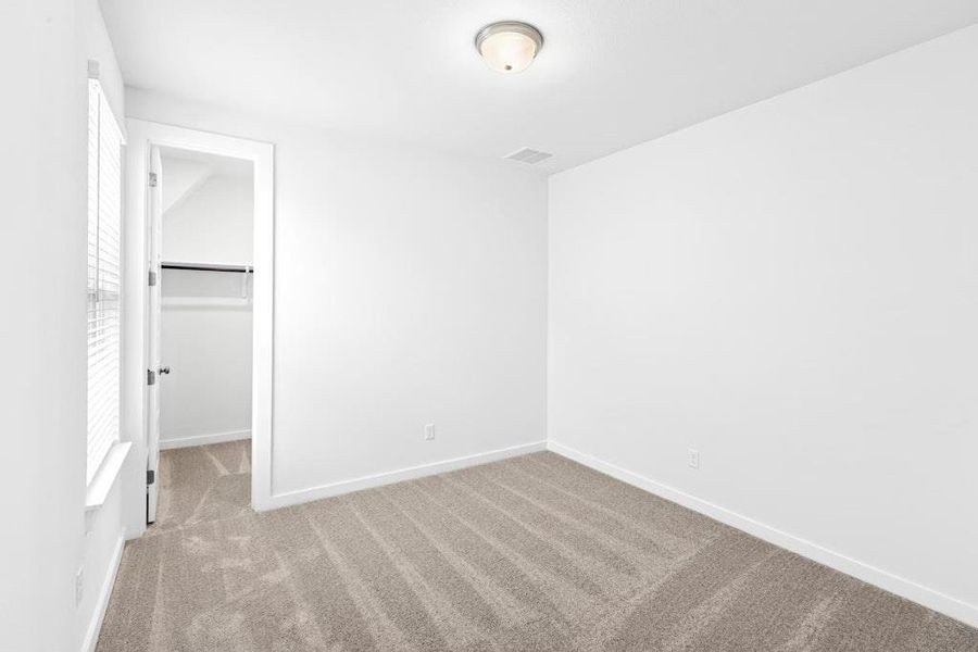 Spacious, unfurnished interior of a new home in The Colony, Bastrop (Image 26).