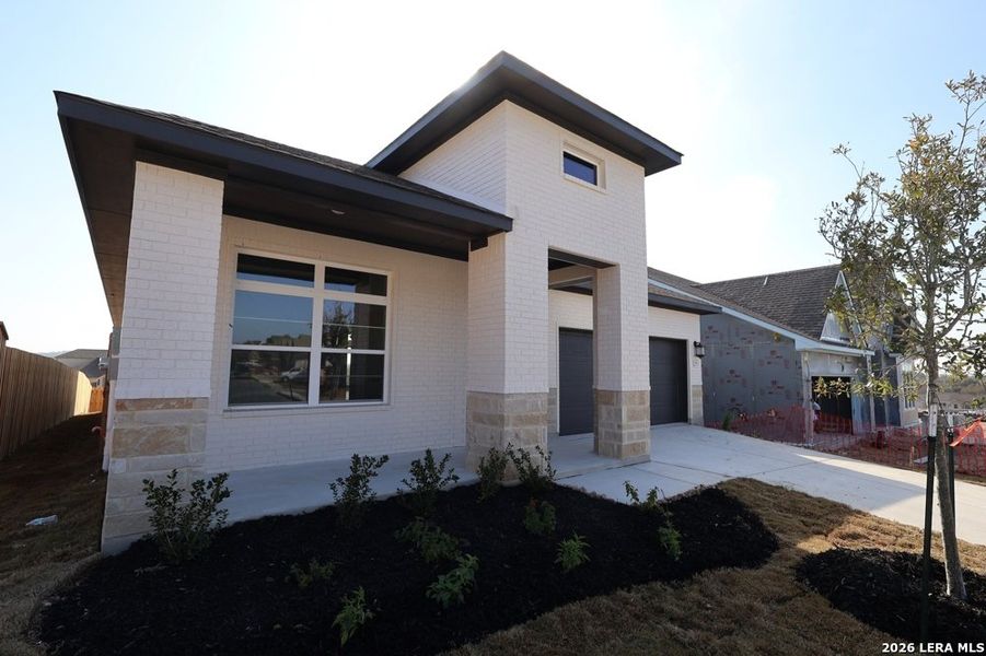 Exterior details and patio area of a home in Windsong - Reserve Series, Boerne (Image 2).