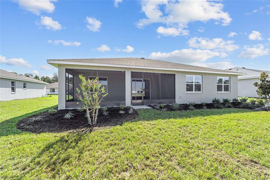 Exterior details and patio area of a home in On Top of the World Communities, Ocala (Image 3).