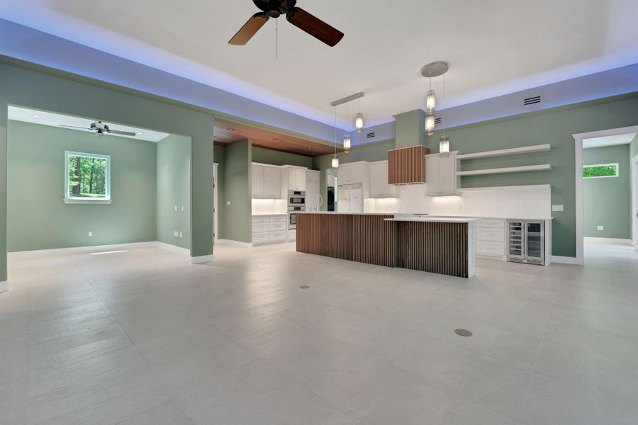 Spacious open floor plan. The kitchen has a large center island with wood accent.