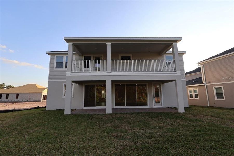 Exterior details and patio area of a home in Center Lake on the Park, St. Cloud (Image 4).
