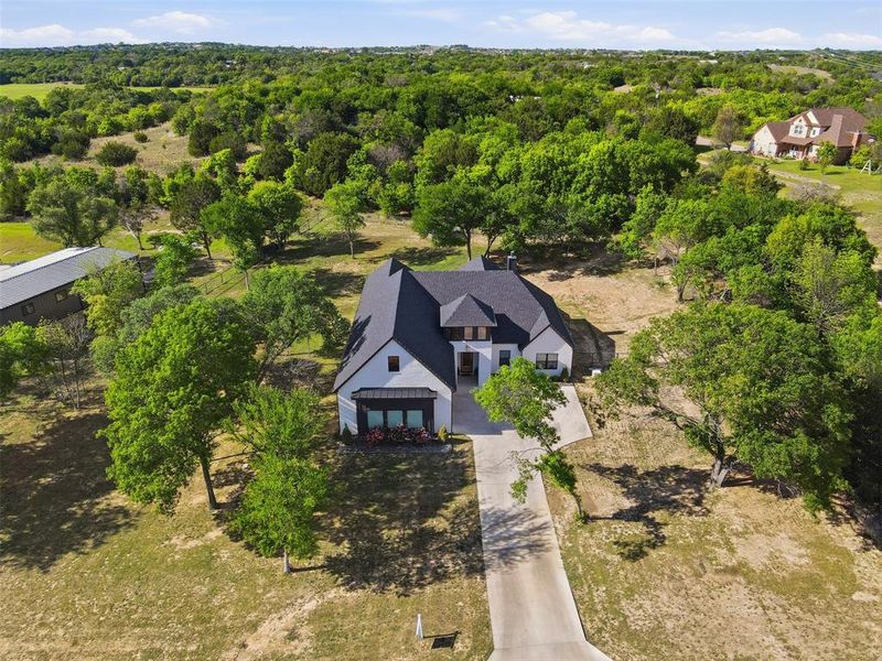 Front exterior of a new home in , Azle, TX, highlighting curb appeal (Image 21). Front exterior of a new home in , Azle, TX, highlighting curb appeal (Image 21).
