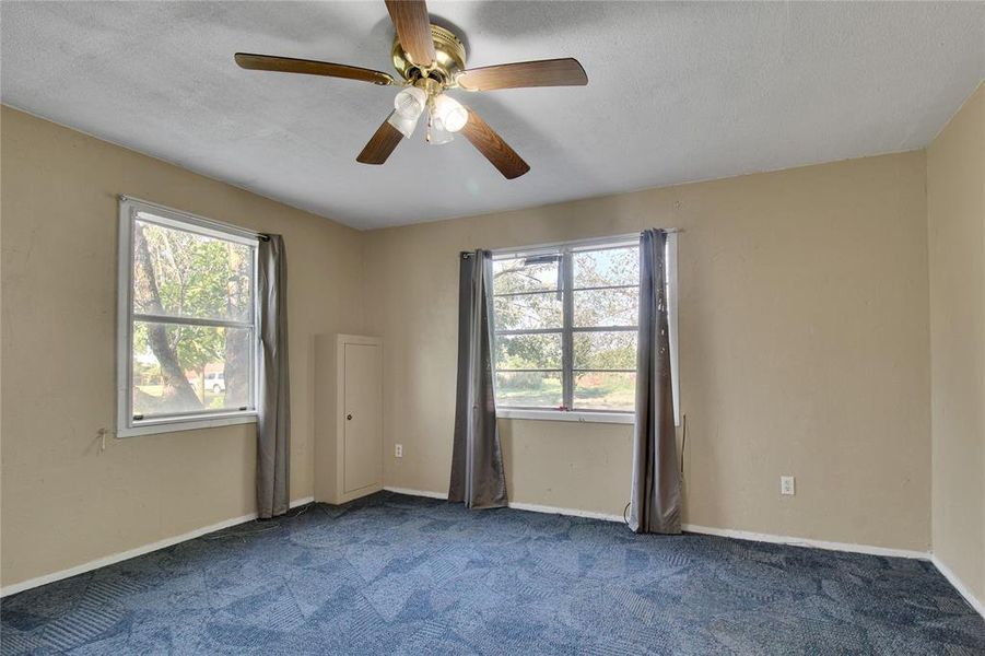 Spare room featuring carpet flooring and ceiling fan Spare room featuring carpet flooring and ceiling fan