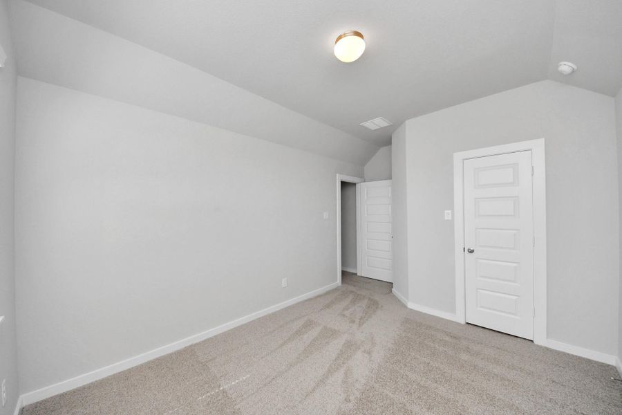 Generously sized secondary bedrooms featuring spacious closets, soft and inviting carpeting underfoot, large windows allowing plenty of natural light, and the added touch of privacy blinds for your personal retreat. Sample photo of completed home with similar floor plan. Actual colors and selections may vary. Generously sized secondary bedrooms featuring spacious closets, soft and inviting carpeting underfoot, large windows allowing plenty of natural light, and the added touch of privacy blinds for your personal retreat. Sample photo of completed home with similar floor plan. Actual colors and selections may vary.