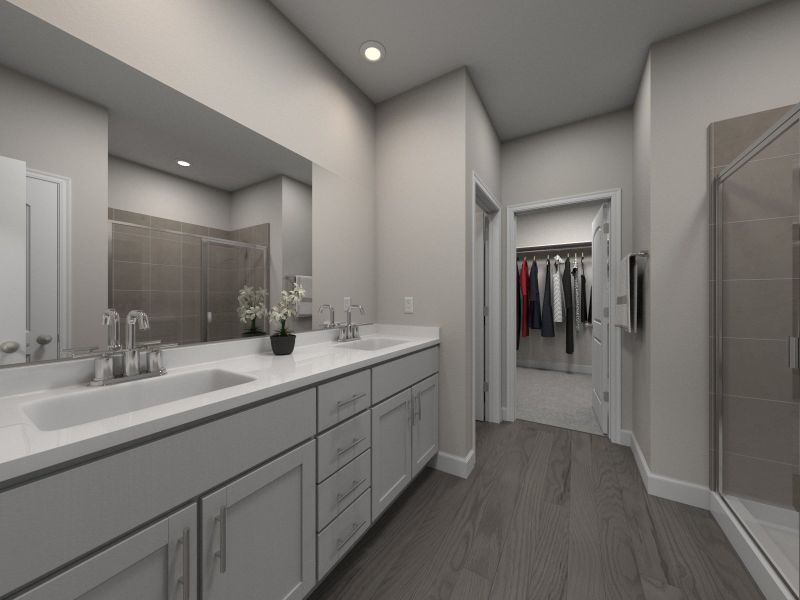 The primary bathroom offers dual vanity sinks and a walk-in shower.