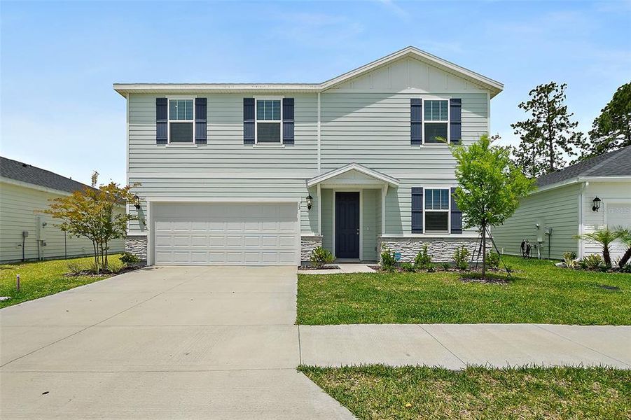 Front exterior of a new home in , Palm Coast, FL, highlighting curb appeal (Image 25). Front exterior of a new home in , Palm Coast, FL, highlighting curb appeal (Image 25).