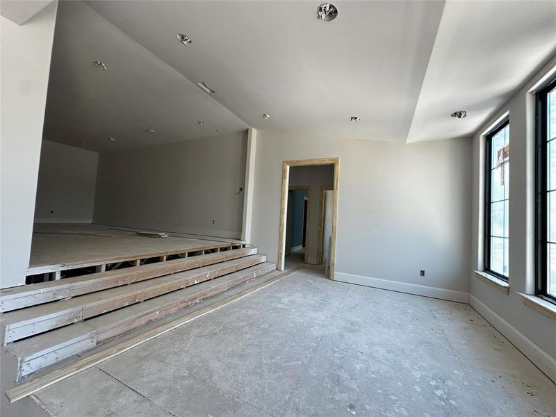 Unfurnished room featuring vaulted ceiling