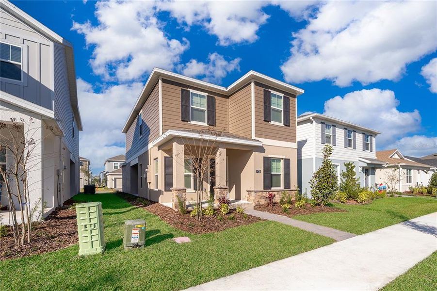 Front exterior of a new home in , Orlando, FL, highlighting curb appeal (Image 19).