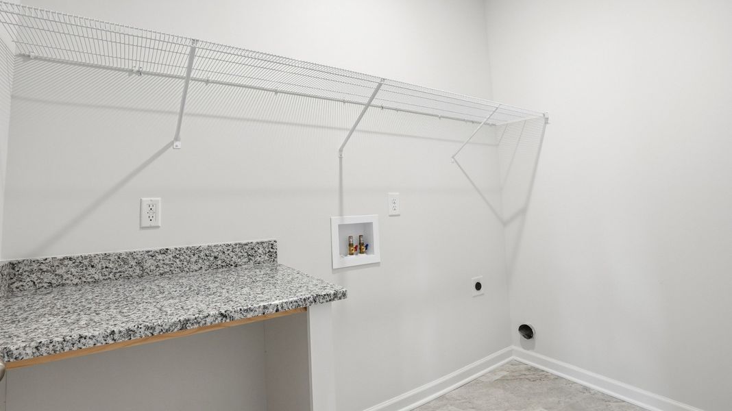 laundry room with folding table
