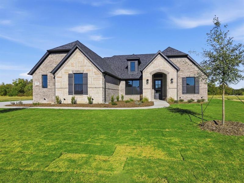 Front exterior of a new home in Silver Sage Farm, Weatherford, TX, highlighting curb appeal (Image 23). Front exterior of a new home in Silver Sage Farm, Weatherford, TX, highlighting curb appeal (Image 23).