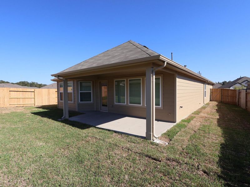Exterior details and patio area of a home in Pinewood at Grand Texas, New Caney (Image 3). Exterior details and patio area of a home in Pinewood at Grand Texas, New Caney (Image 3).
