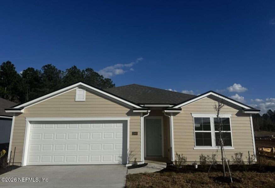 Front exterior of a new home in The Arbors, Jacksonville, FL, highlighting curb appeal (Image 27).