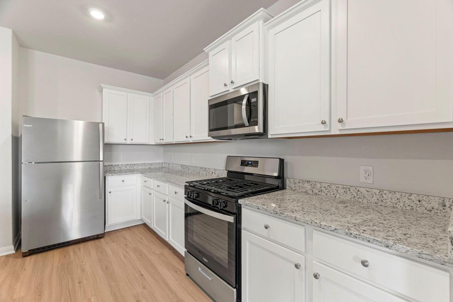 Furnished interior view inside a new home in Canterra Creek, Iowa Colony (Image 4).