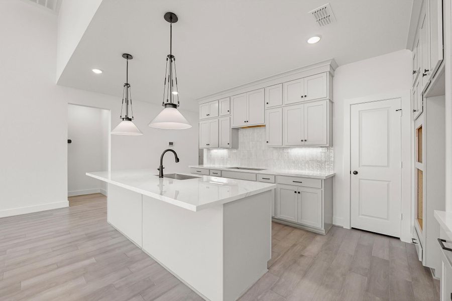 Spacious Island Kitchen Featuring Ample Cabinet Space For Storage