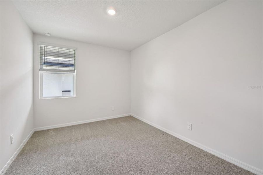 Spacious, unfurnished interior of a new home in Ridgehaven - Villas, Ormond Beach (Image 18).