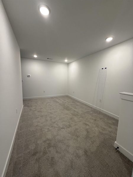 Empty room featuring carpet and recessed lighting