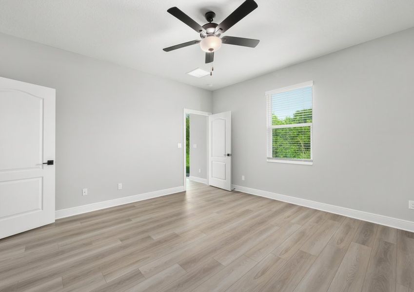 Vinyl flooring is featured in the master bathroom